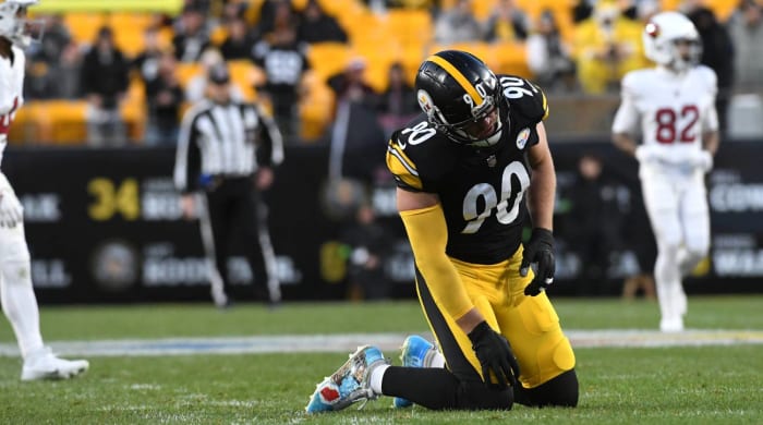 T.J. Watt is slow to get up after a play against the Cardinals.